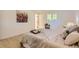 Inviting main bedroom with serene paint, natural light from the window and a cozy bed at 4475 S Routt St, Littleton, CO 80127