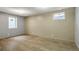 Finished basement with wood-look floors and two windows for great natural light at 1005 S Lewiston Way, Aurora, CO 80017
