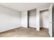 Bright bedroom featuring large closet and neutral tones throughout at 1005 S Lewiston Way, Aurora, CO 80017