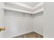Walk-in closet with neutral colored carpet, ample hanging space, and neutral paint color at 1005 S Lewiston Way, Aurora, CO 80017