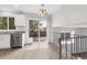 Open dining area featuring granite countertops, stainless steel appliances, and patio access at 1005 S Lewiston Way, Aurora, CO 80017