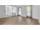 Bright living room offering stylish floors, a front door, and natural light at 1005 S Lewiston Way, Aurora, CO 80017