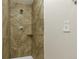 Shower with attractive tile surround and chrome fixtures at 1005 S Lewiston Way, Aurora, CO 80017