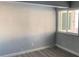 Simple bedroom with grey walls and laminate flooring at 2678 S Xanadu Way # C, Aurora, CO 80014