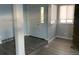 Bright entryway with a stained-glass window and grey laminate flooring at 2678 S Xanadu Way # C, Aurora, CO 80014