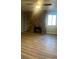 Living room with a stone fireplace and built-in shelving at 2678 S Xanadu Way # C, Aurora, CO 80014