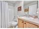 Well-lit bathroom with a shower-tub combo, vanity with sink, and neutral decor offering a clean, functional space at 7193 S Versailles Way, Aurora, CO 80016