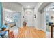 Bright foyer with hardwood floors, arched entryways, and plenty of natural light, creating a welcoming entrance at 7193 S Versailles Way, Aurora, CO 80016