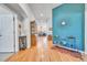 Inviting foyer boasts hardwood floors, stylish decor, and an open floor plan, creating a warm and welcoming atmosphere at 7193 S Versailles Way, Aurora, CO 80016