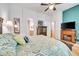 Main bedroom boasts accent wall, television, and spacious layout at 7193 S Versailles Way, Aurora, CO 80016
