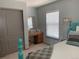 Cozy bedroom with a built-in vanity, closet, and ample natural light at 10634 Ashfield St, Highlands Ranch, CO 80126