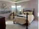 Comfortable bedroom featuring a spacious bed, neutral decor, and plenty of natural light at 10634 Ashfield St, Highlands Ranch, CO 80126