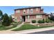 Inviting two-story home with stone accents, landscaped front yard, and well-maintained lawn at 10634 Ashfield St, Highlands Ranch, CO 80126