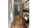 Hallway featuring hardwood floors, a staircase, and decorative furnishings at 10634 Ashfield St, Highlands Ranch, CO 80126