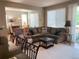 Comfortable living room featuring plush seating, large windows, and stylish decor at 10634 Ashfield St, Highlands Ranch, CO 80126