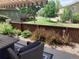 Outdoor patio area with comfortable seating and scenic views of the landscaped yard at 10634 Ashfield St, Highlands Ranch, CO 80126