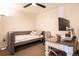 Well-lit bedroom featuring a daybed with decorative pillows and a desk with a modern monitor at 1750 Wewatta St # 728, Denver, CO 80202
