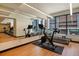 Well-equipped gym featuring modern exercise equipment and bright lighting at 1750 Wewatta St # 728, Denver, CO 80202