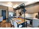 Modern kitchen with stainless steel appliances and central island at 1750 Wewatta St # 728, Denver, CO 80202