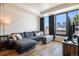 Living room with couch and city view at 1750 Wewatta St # 728, Denver, CO 80202