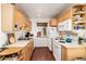Efficient kitchen with light wood cabinets, modern appliances and cozy breakfast nook at 100 Now Colorado Ct # D1, Breckenridge, CO 80424
