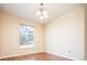Dining room with hardwood floors and a window offering natural light at 7432 S Quail Cir # 1818, Littleton, CO 80127