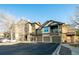 Exterior view of townhome showing parking, balcony, and surrounding landscape at 7432 S Quail Cir # 1818, Littleton, CO 80127