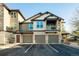 Beautiful townhome featuring stone accents, three garage spaces, and a private balcony at 7432 S Quail Cir # 1818, Littleton, CO 80127