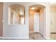 Hallway showcasing archways, carpet, and white trim and doors at 7432 S Quail Cir # 1818, Littleton, CO 80127