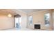 Spacious living room with fireplace, ample natural light, and access to balcony at 7432 S Quail Cir # 1818, Littleton, CO 80127