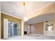 Open living room with fireplace, sliding glass door, and chandelier at 7432 S Quail Cir # 1818, Littleton, CO 80127