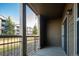 Private outdoor patio provides views of the community grounds, building exterior and mature trees at 7432 S Quail Cir # 1818, Littleton, CO 80127