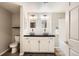 A full bathroom featuring double sinks and white subway tile at 7440 S Blackhawk St # 4-104, Englewood, CO 80112