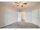 A bedroom featuring neutral walls, carpet, and a closet with shelving at 7440 S Blackhawk St # 4-104, Englewood, CO 80112