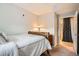 Bedroom featuring carpet, neutral walls, and ensuite bathroom at 7440 S Blackhawk St # 4-104, Englewood, CO 80112