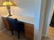 Charming desk area featuring bright lighting, wood cabinetry, and a comfortable blue chair at 7440 S Blackhawk St # 4-104, Englewood, CO 80112