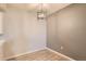 A dining area featuring wood-look floors and a modern, lantern-style light fixture at 7440 S Blackhawk St # 4-104, Englewood, CO 80112