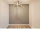 A dining area featuring gray accent wall and a modern, lantern-style light fixture at 7440 S Blackhawk St # 4-104, Englewood, CO 80112