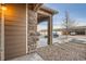 Exterior view of the garage with ample parking and stone architecture at 7440 S Blackhawk St # 4-104, Englewood, CO 80112