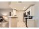Open kitchen with a breakfast bar, stainless steel appliances, and recessed lighting at 7440 S Blackhawk St # 4-104, Englewood, CO 80112