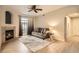 Bright living room with a fireplace, neutral-toned sofa, and natural light at 7440 S Blackhawk St # 4-104, Englewood, CO 80112