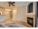 Living room view showcasing fireplace, access to other rooms, and stylish decor at 7440 S Blackhawk St # 4-104, Englewood, CO 80112