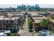 Aerial view showcases city skyline views with lush trees and various buildings in the neighborhood at 1711 Boulder St, Denver, CO 80211