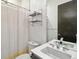 Modern bathroom with sleek fixtures, stylish shelving, and a minimalist design at 1711 Boulder St, Denver, CO 80211
