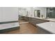 This bathroom features dual sinks, tile work, and a soaking tub at 1711 Boulder St, Denver, CO 80211