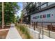 Exterior street view of a commercial building featuring a distinctive sign, outdoor seating, and sidewalk access at 1711 Boulder St, Denver, CO 80211