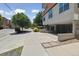 Contemporary building features an attached garage and landscaped entry on a tree-lined street at 1711 Boulder St, Denver, CO 80211