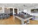 Spacious game room with ping pong table, bar, and stylish seating area at 1711 Boulder St, Denver, CO 80211