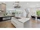 Bright, modern kitchen with a large island, stainless steel appliances, and an open floor plan perfect for entertaining at 1711 Boulder St, Denver, CO 80211