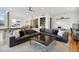 Inviting living room has a comfortable sectional sofa, a bar, and hardwood floors at 1711 Boulder St, Denver, CO 80211